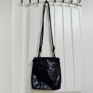 The Trend Black Leather Tri Pocket Convertible Purse and Backpack. 9” x 10” x 4”
